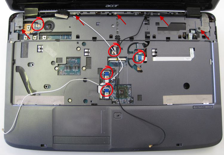 Undo the ribbons and cables circled from the laptop and undo the screws pointed to. The black and white cables need undoing, they used to connect to the wireless card underneath. Then undo the two screws (far left and far right) that hold the screen to the base. Hold onto the screen as you take the two screws out.
