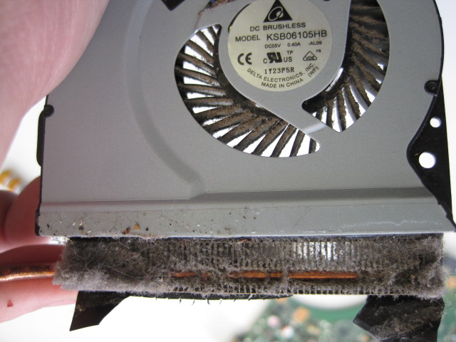 Clean the visible dust and then undo the 4 screws holding the top cover to the fan.