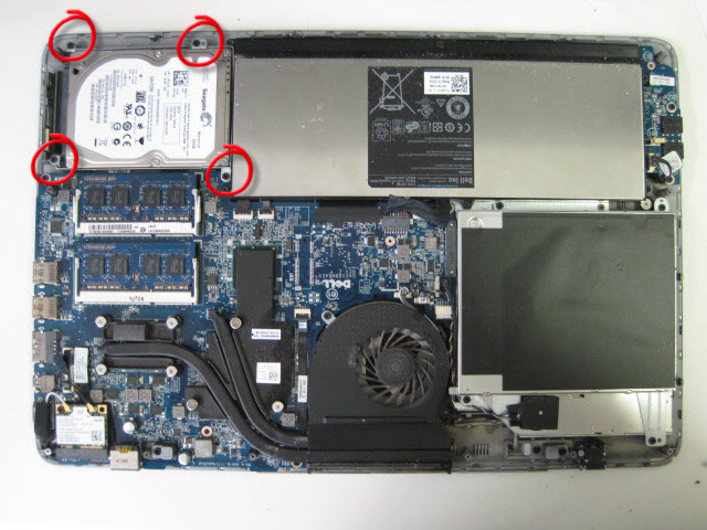 Undo the four screws to remove the hard drive from the laptop